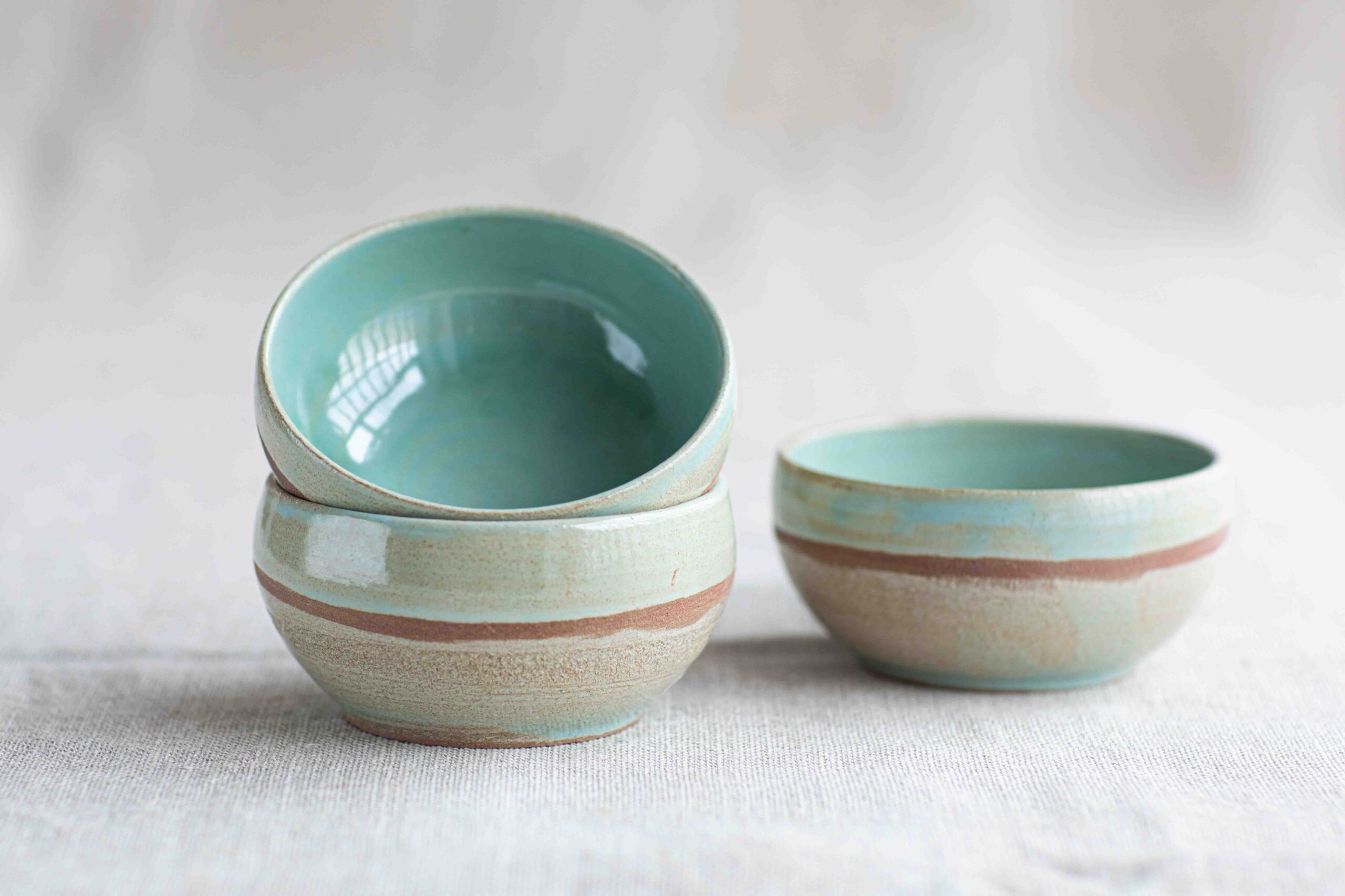 Buño pottery with green and cream rustic style glaze. 
