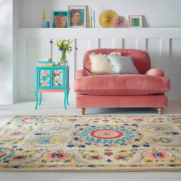 Incorporate budget friendly area rugs with bold designs