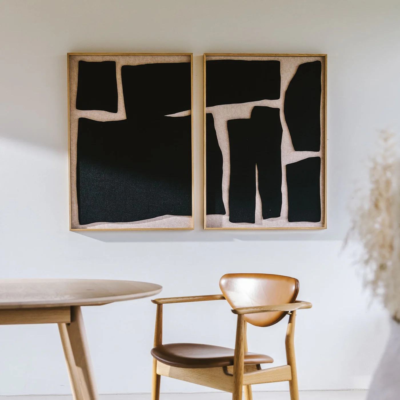 Eye level acoustic panel art in contemporary bañck and white felt