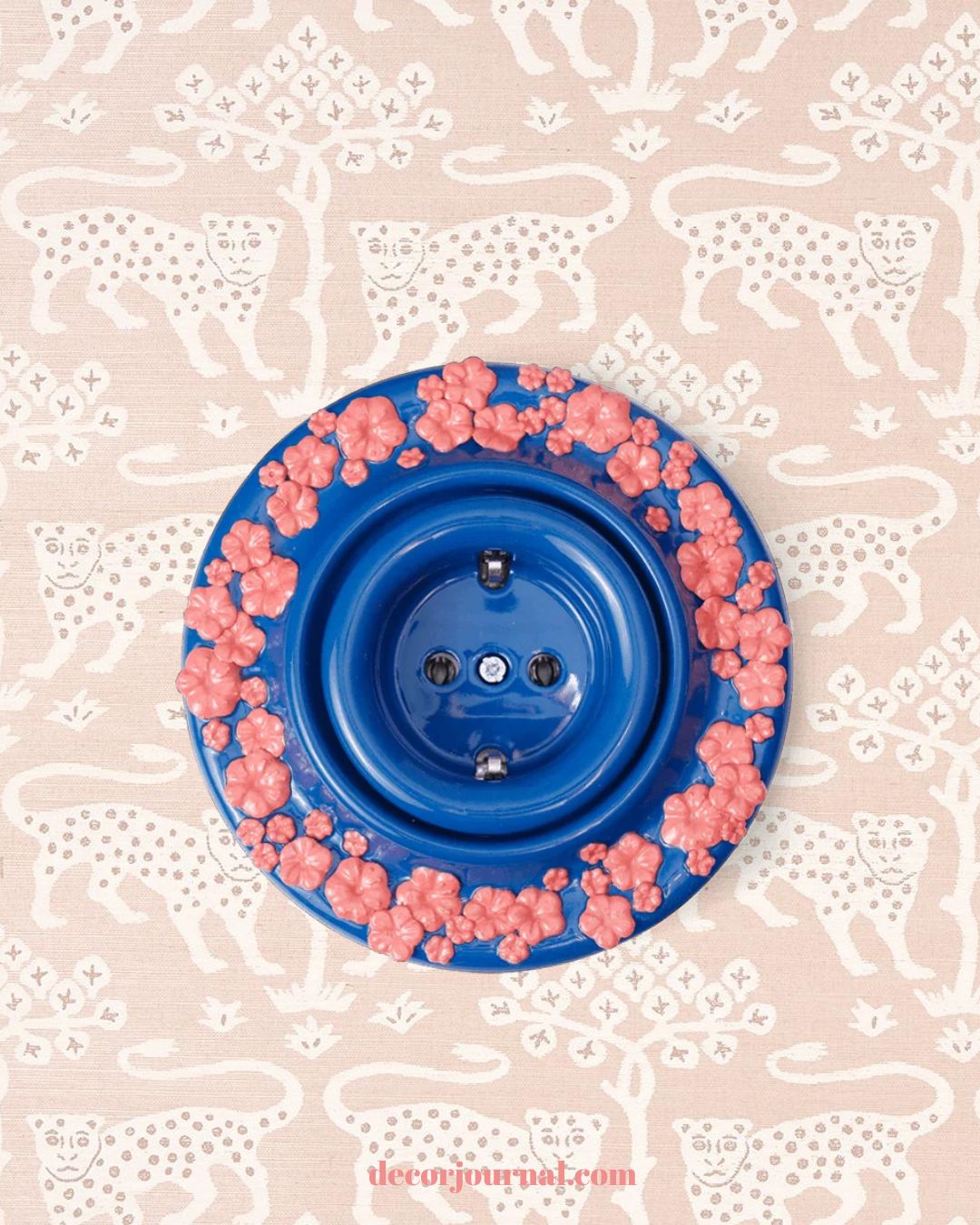 Blue ceramic Sakura socket by Rosetta on pink leopard wallpaper.