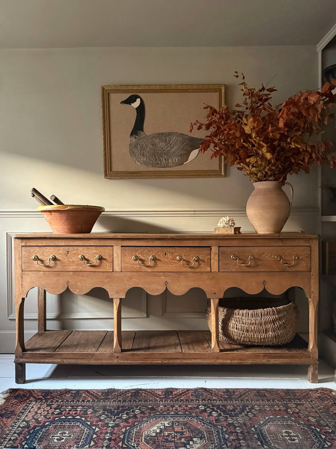 Artisan decor on antique sideboard