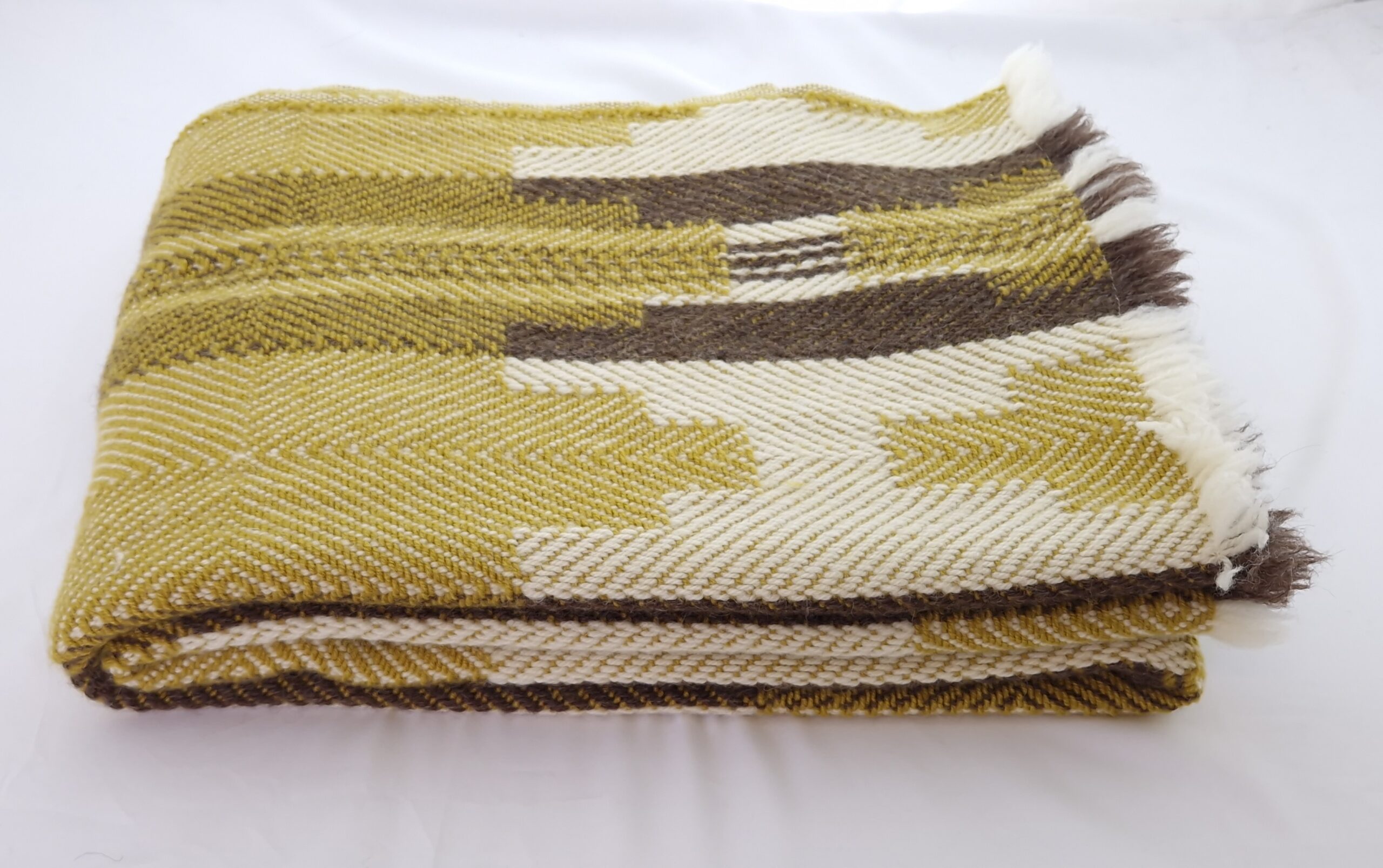 Bulgarian Shevitza Wool Blanket in mustard and cream with brown accents. 