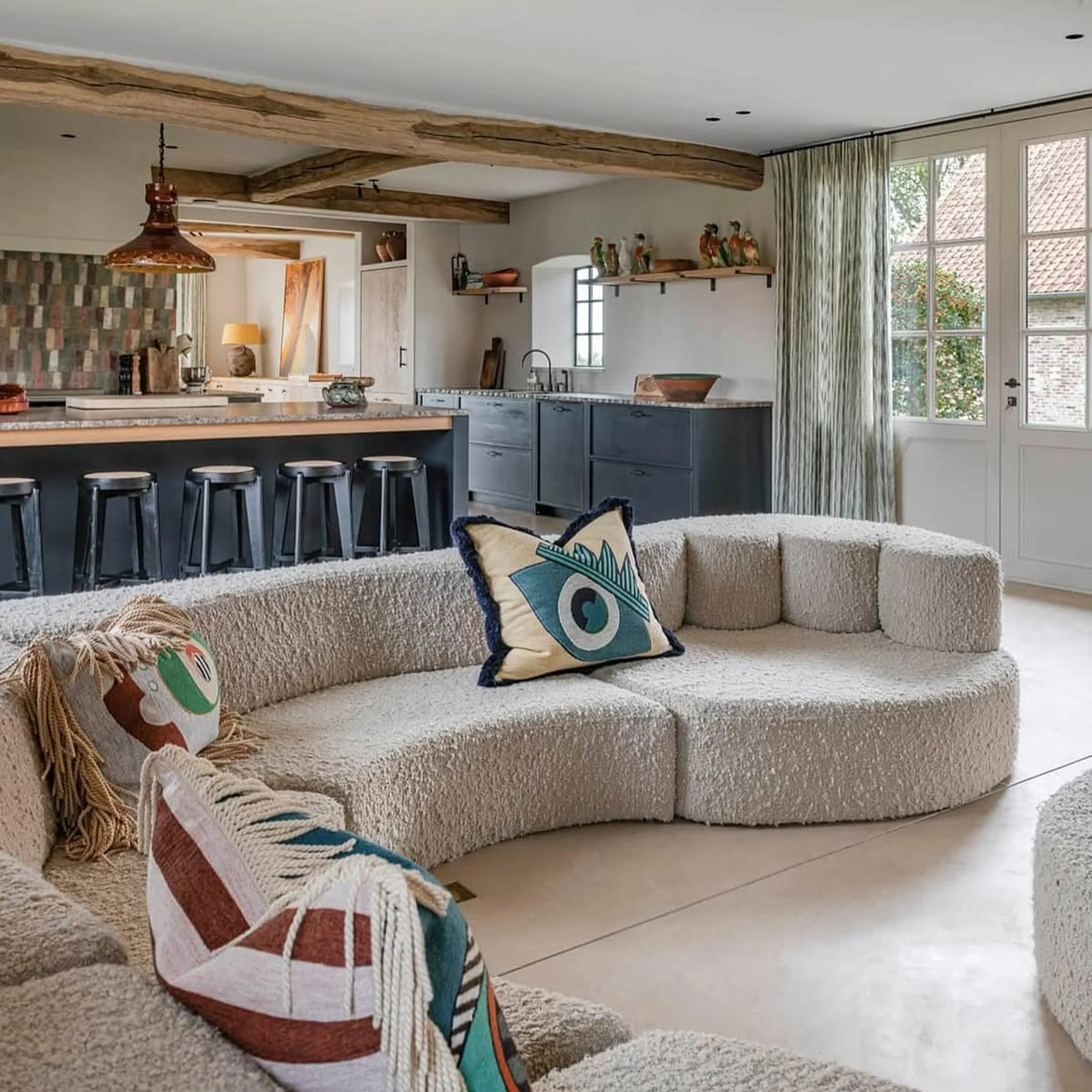 Curved sofa in open plan living area