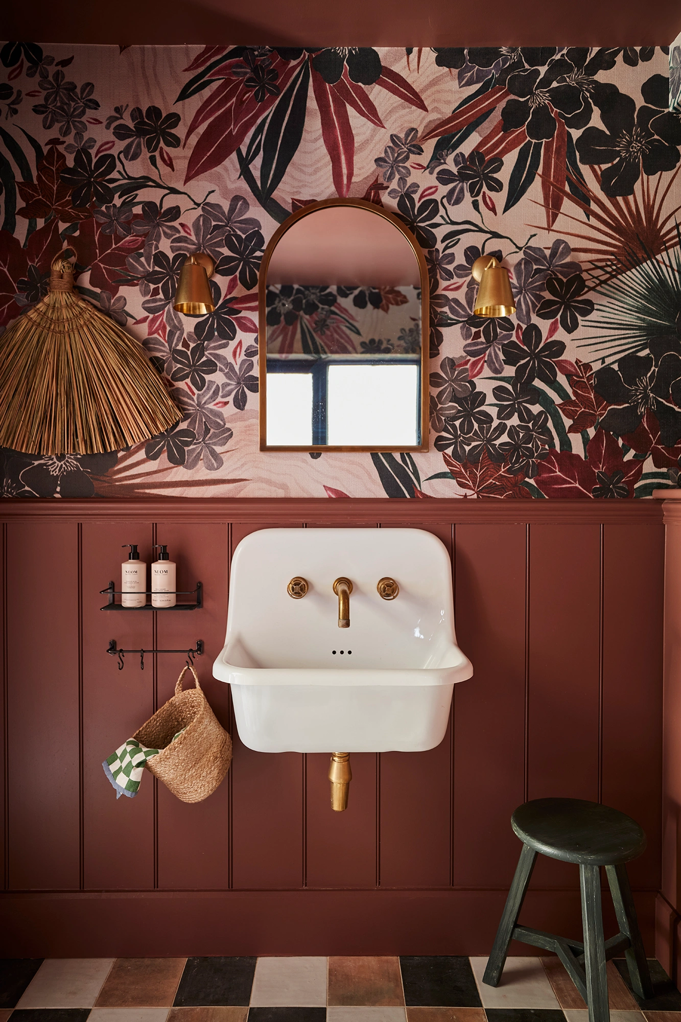 curved sink in burgundy bathroom