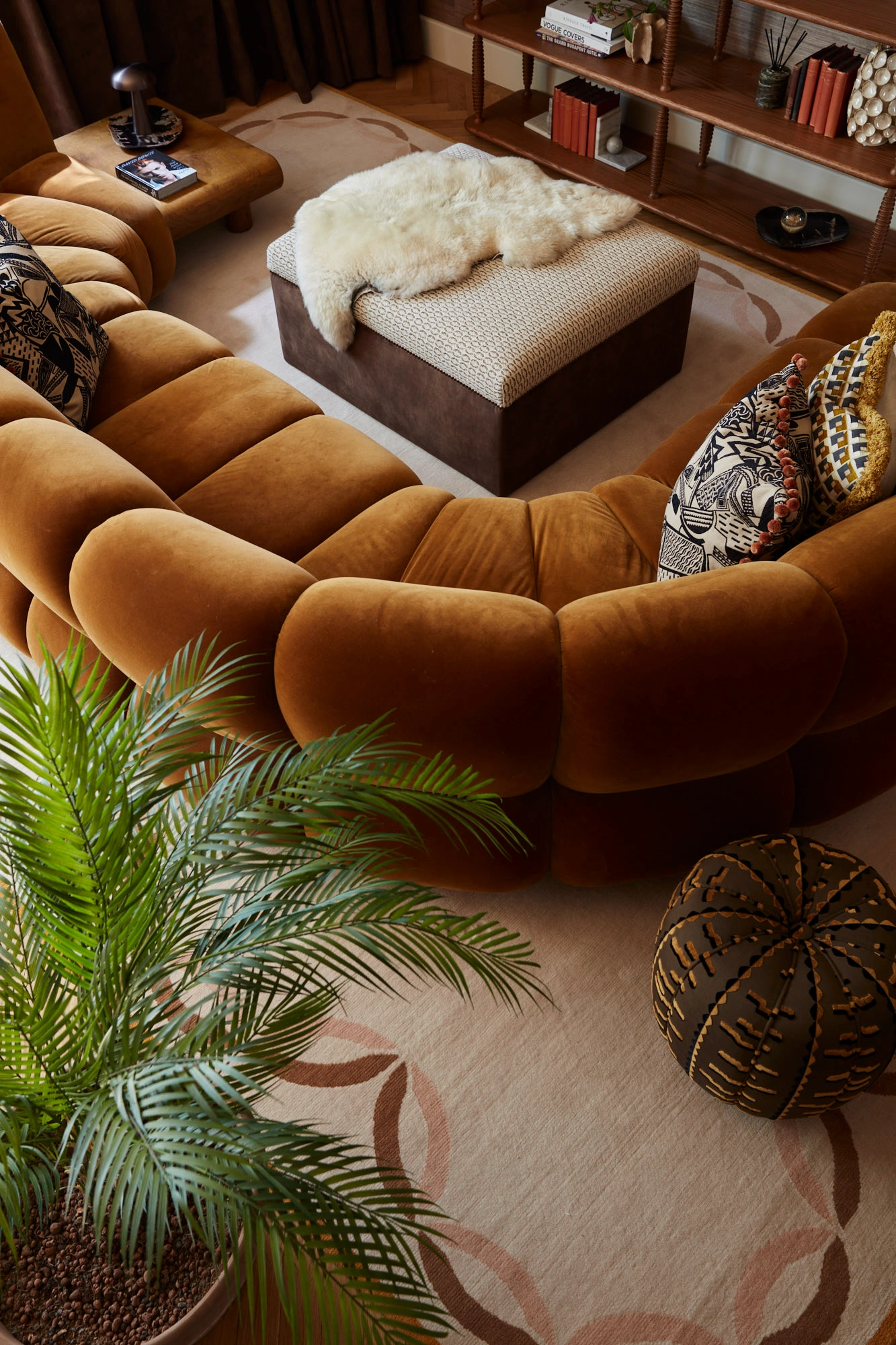 Curved velvet ochre sofa 