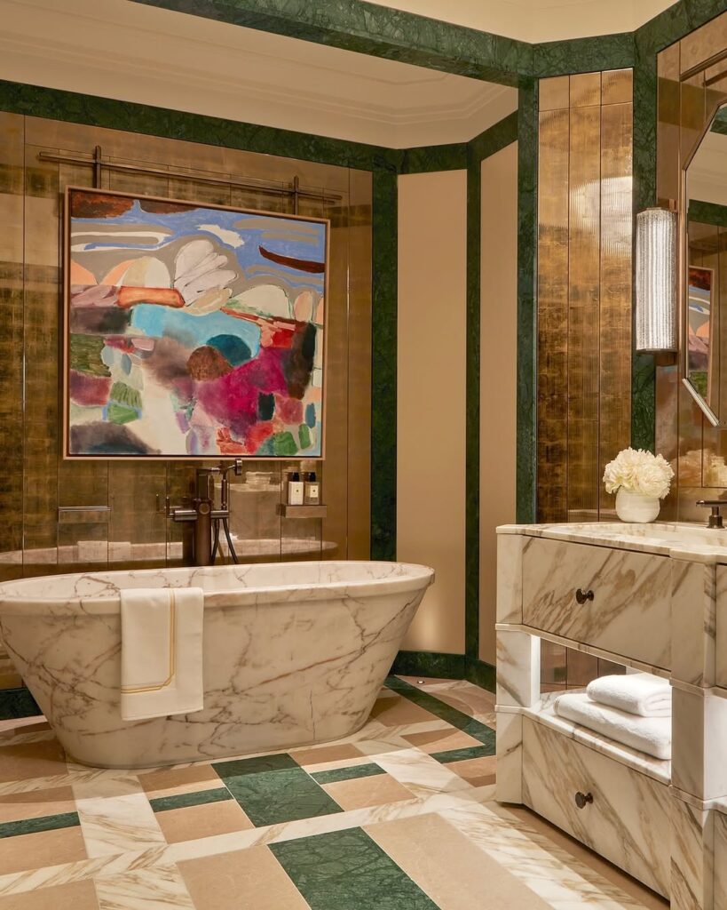 Hollywood regency marble and mirrored bathroom by Laura Hammett